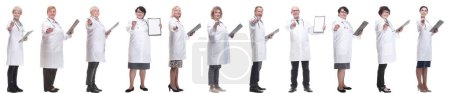 Photo for Full length group of doctors with notepad isolated on white background - Royalty Free Image