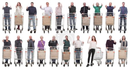 Photo for Group of people with shopping cart showing thumbs up isolated on white background - Royalty Free Image