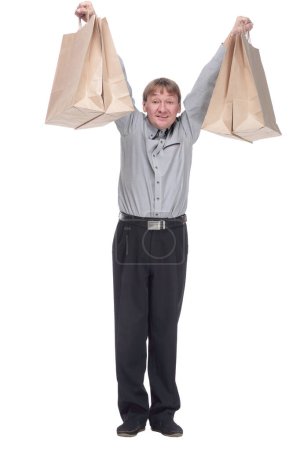 Photo for Full length. happy mature man showing his shopping bags. isolated on a white background. - Royalty Free Image