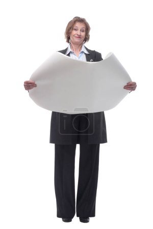 Photo for Full length of an senior woman architect standing with open blueprints isolated over white background. Concept repair, construction and building - Royalty Free Image