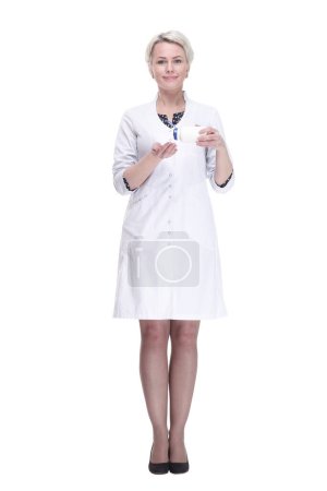 Photo for Full-length. female doctor using sanitizer. isolated on a white background. - Royalty Free Image