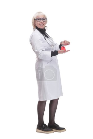 in full growth. female doctor with a laboratory flask. isolated on a white background.