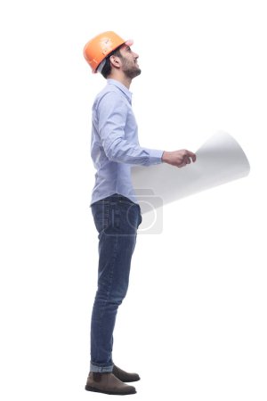 Photo for Side view. male architect looking at a drawing of a new project . isolated on a white background. - Royalty Free Image