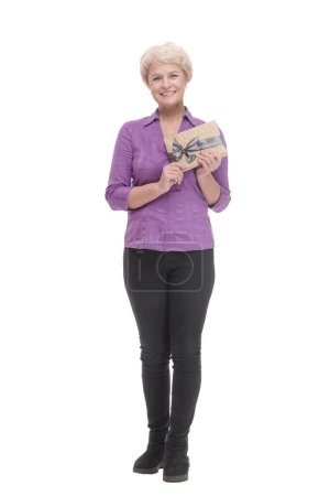 Photo for In full growth. happy mature woman with gift box. isolated on a white background. - Royalty Free Image