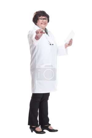 Photo for In full growth. senior female doctor with a digital tablet . isolated on a white background. - Royalty Free Image