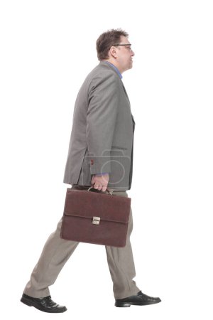 Photo for Full-length. business man with a leather briefcase. isolated on a white background. - Royalty Free Image