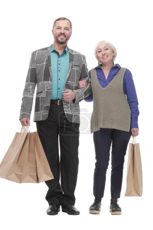 Photo for In full growth. happy married couple with shopping bags. isolated on a white background. - Royalty Free Image