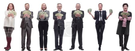 Foto de Grupo de personas exitosas con dinero en sus manos mirando a la cámara sobre un fondo blanco - Imagen libre de derechos