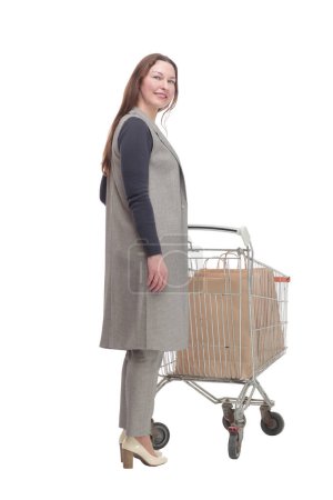 Photo for In full growth. elegant woman with a shopping cart.isolated on a white background. - Royalty Free Image