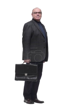 Photo for In full growth. a confident business man with a leather briefcase. isolated on a white background - Royalty Free Image