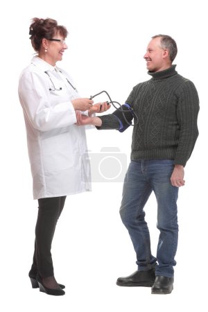 Photo for Senior smiling cheerful female medicine doctor measuring blood pressure to patient. Medical and healthcare concept - Royalty Free Image