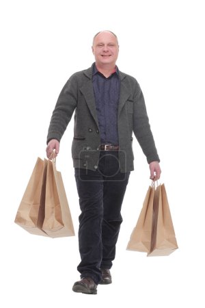 Photo for In full growth. cheerful casual man with shopping bags .isolated on a white background. - Royalty Free Image