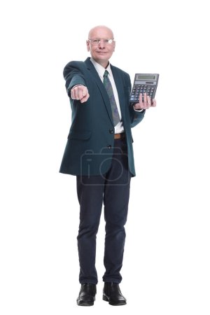 Photo for In full growth. serious business man pointing at the calculator screen. isolated on a white background. - Royalty Free Image