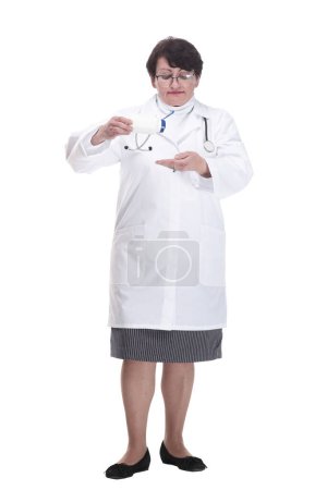 in full growth. senior female medic with sanitizer in hand. isolated on a white background.