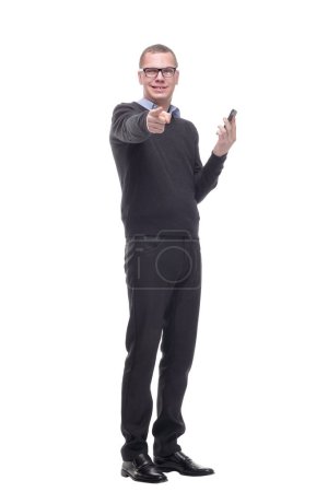 Photo for Young adult man talking on the phone pointing with finger to the camera and to you, hand sign, positive and confident gesture from the front - Royalty Free Image