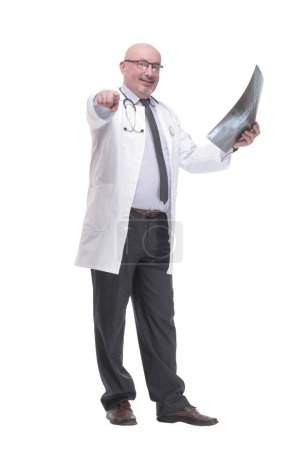 Foto de Full-length. mature doctor with x-ray .isolated on a white background. - Imagen libre de derechos