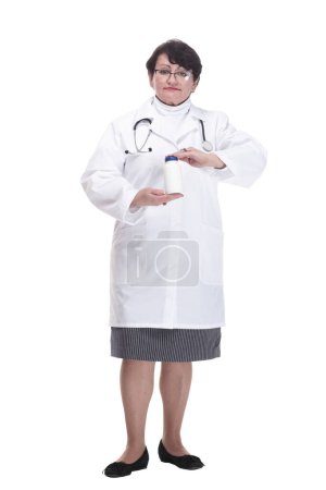 Photo for In full growth. senior female medic with sanitizer in hand. isolated on a white background. - Royalty Free Image