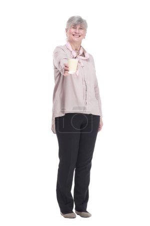 Photo for Full-length.casual elderly woman with coffee to take away . isolated on a white background. - Royalty Free Image