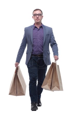 Photo for Picture of handsome smiling man in suit with shopping bags looking at camera - Royalty Free Image