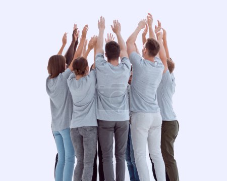 Foto de En pleno crecimiento. grupo de jóvenes de pie en un círculo con las manos en alto. foto con espacio de copia - Imagen libre de derechos