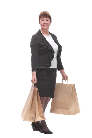 Photo for Full isolated portrait of a senior woman with shopping bags happy smiling and looking at camera - Royalty Free Image
