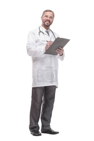 Photo for In full growth. smiling doctor with clipboard . isolated on a white background. - Royalty Free Image