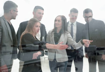Photo for Close up. business team standing in front of a glass wall. - Royalty Free Image