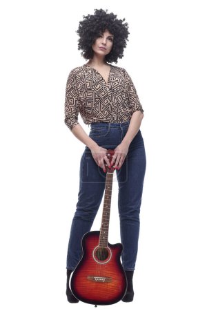 Photo for In full growth. stylish young woman with a guitar . isolated on a white background. - Royalty Free Image