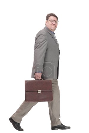 full-length. business man with a leather briefcase. isolated on a white background.
