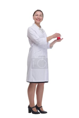 Foto de En pleno crecimiento. mujer médica con un frasco de laboratorio. aislado sobre un fondo blanco. - Imagen libre de derechos