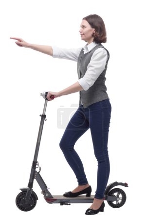Foto de Mujer madura casual con scooter eléctrico. aislado sobre un fondo blanco. - Imagen libre de derechos