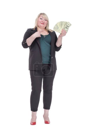 in full growth. attractive woman with a wad of banknotes. isolated on a white background.