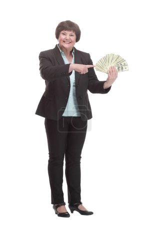 Photo for Mature business woman with a bundle of banknotes . isolated on a white background. - Royalty Free Image