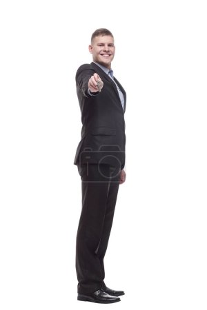 Foto de En pleno crecimiento. feliz joven hombre de negocios con llaves en la mano. aislado sobre un fondo blanco. - Imagen libre de derechos