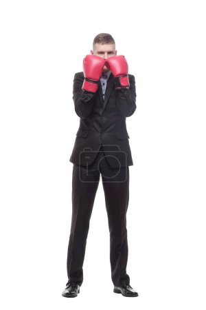 Photo for In full growth. young businessman in Boxing gloves. isolated on a white background. - Royalty Free Image