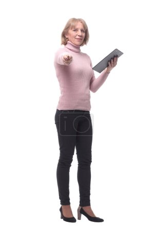 Photo for Full length portrait of smiling business woman pointing on blank clipboard isolated over white background - Royalty Free Image