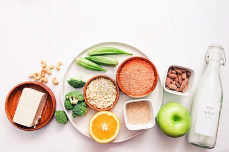 Photo for Portfolio diet products, top view. Foods for lowering cholesterol, plant based proteins, vegetables and nuts - Royalty Free Image