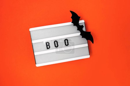 Photo for Minimal Halloween decor, lightbox with word Boo and bat silhouette - Royalty Free Image