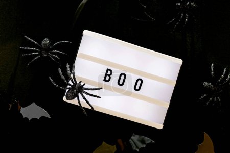 Photo for Traditional Halloween decor on black background, bats and spiders - Royalty Free Image