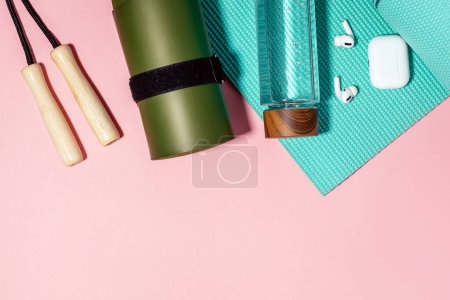 Photo for Fitness accessories on pink background, top view - Royalty Free Image