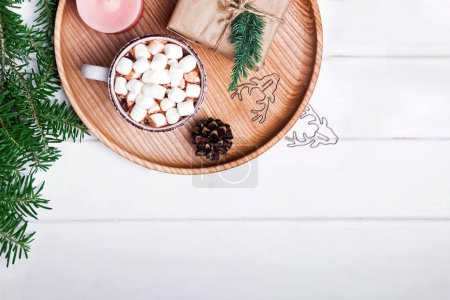Photo for Christmas composition with cocoa with marshmallows, fir branches and other on the wooden tray - Royalty Free Image