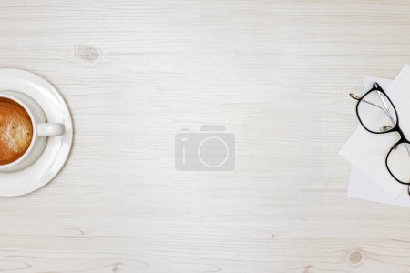 Photo for Tablet mock-up top view on the white wooden table - Royalty Free Image
