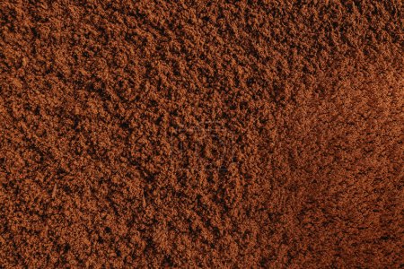Vista de cerca de la textura en polvo de cacao procesado holandés