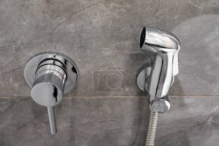 Photo for Chrome hygienic shower in the toilet close-up - Royalty Free Image