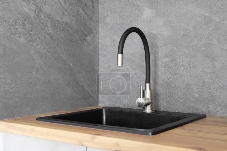 Photo for Faucet with granite sink in the kitchen interior - Royalty Free Image