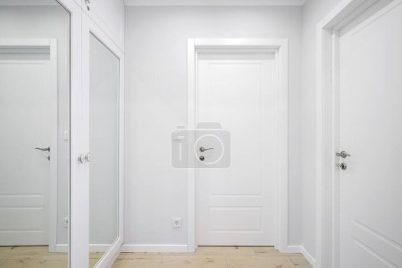 Photo for Hallway with white interior doors in the interior - Royalty Free Image
