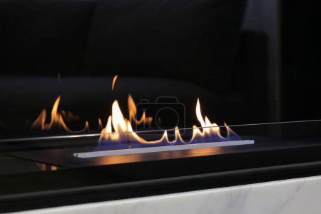 Burning modern eco bio ethanol fireplace close-up