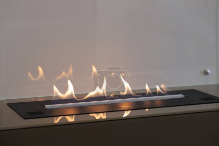 Burning modern eco bio ethanol fireplace built into furniture