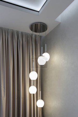 Photo for Modern glowing hanging balls lamps from the ceiling - Royalty Free Image