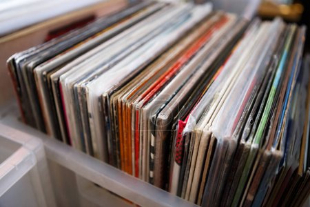 Box of retro vinyl records for sale on fare. Buy old classic music for turntable player